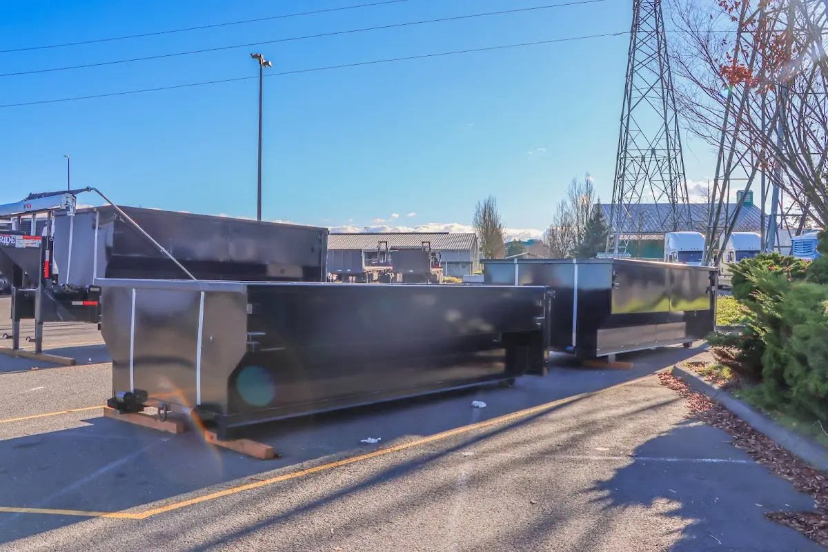 Roll-off dumpster ready for waste disposal at job site for 12 Yard Dumpster Rental in Elmwood Park